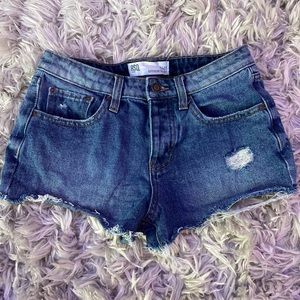 woman's blue, ripped jean shorts